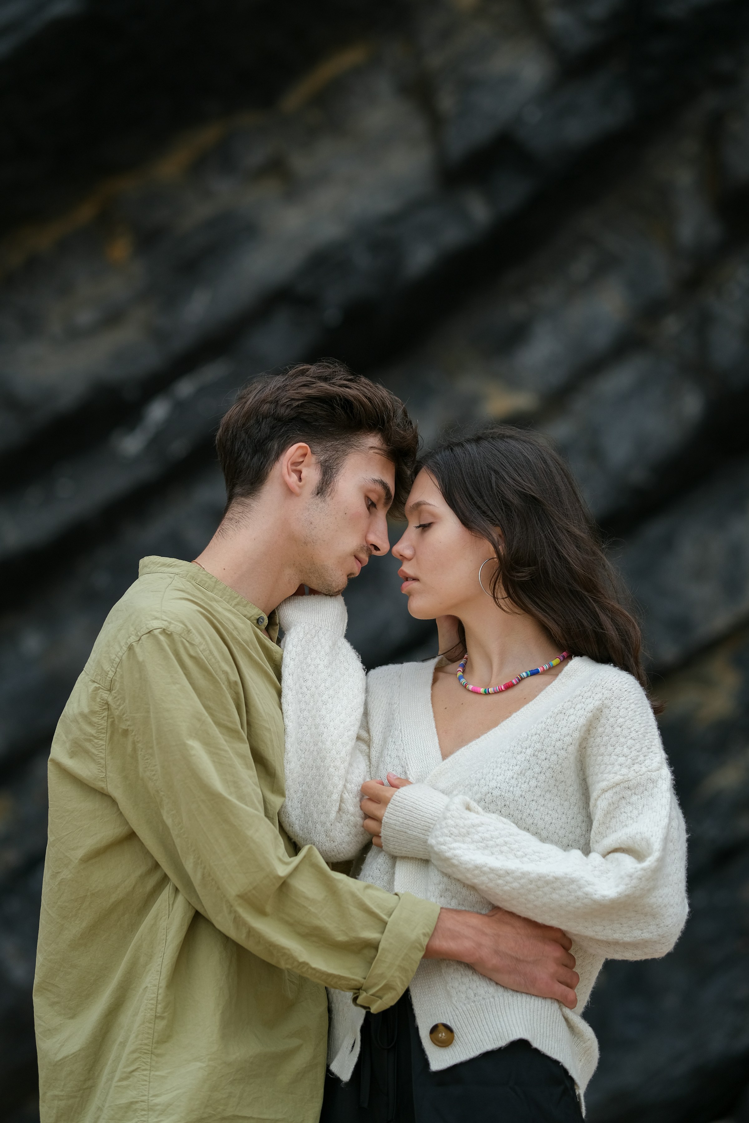 Couple on beach looking at ocean